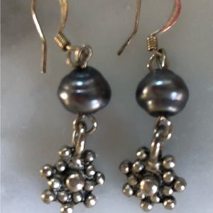 grey pearl type bead with silver flower drop, pierced earrings. pre owned.